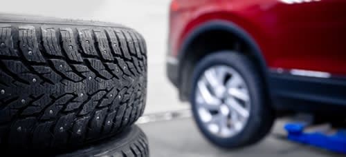 Close-up of stacked winter tires getting ready to be changed out for the seasonal change.